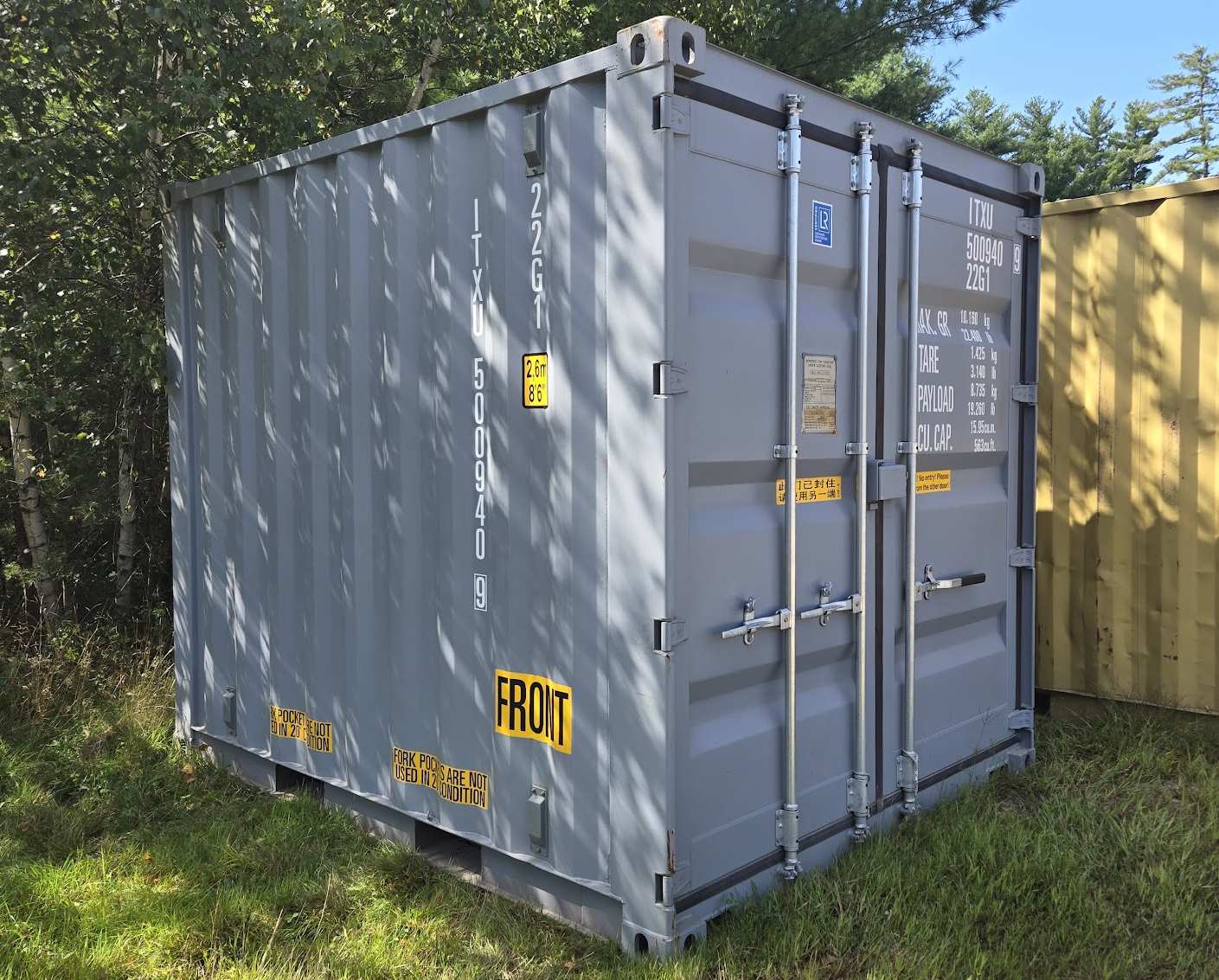 An empty storage container with its doors open